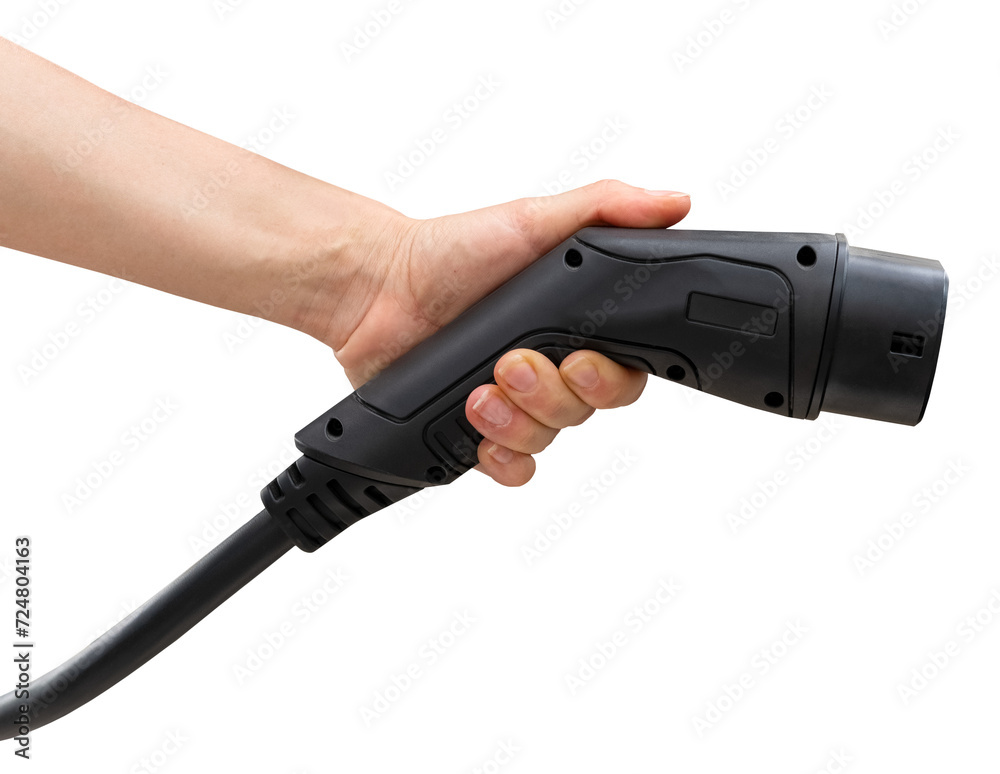 Isolated black EV charging plug in female hand. Electric car charging connector. Isolated black EV charging plug in female hand. Electric car charging connector.