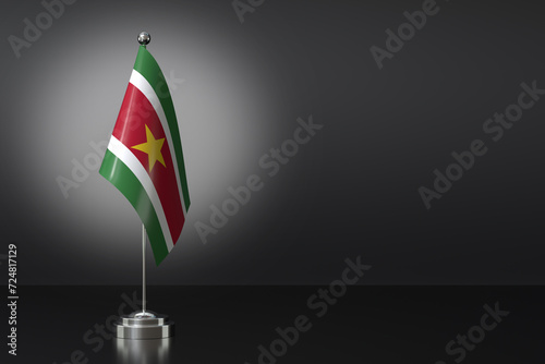 Small Republic of Suriname Flag in Front of Black Background, 3d Rendering photo