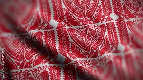 Assamese Gamosa or Gamusa embroidery motifs fabric wave loop. muga silk cloth fluttering in the wind or waving red and white cloth. red Indian pattern. photo