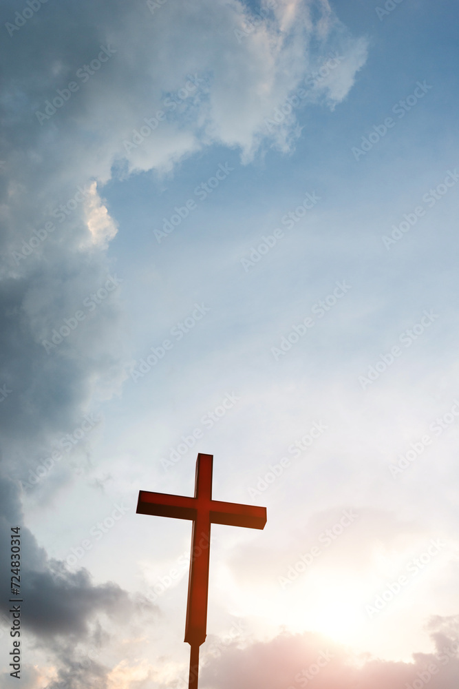 A christian cross under cloudy sky A christian cross under cloudy sky