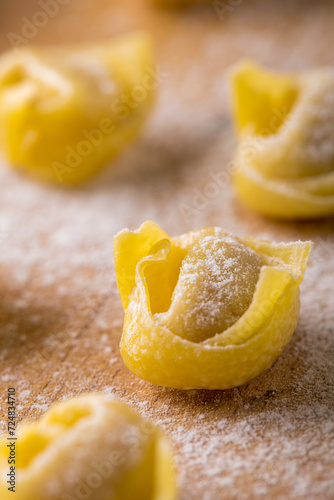 in the foreground raw tortellini Bolognese style