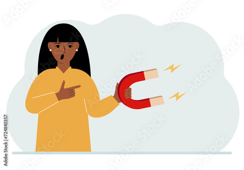 A woman holds a huge magnet in his hand, attracts new customers, money and ideas. Inbound business marketing technologies, lead generation concept.