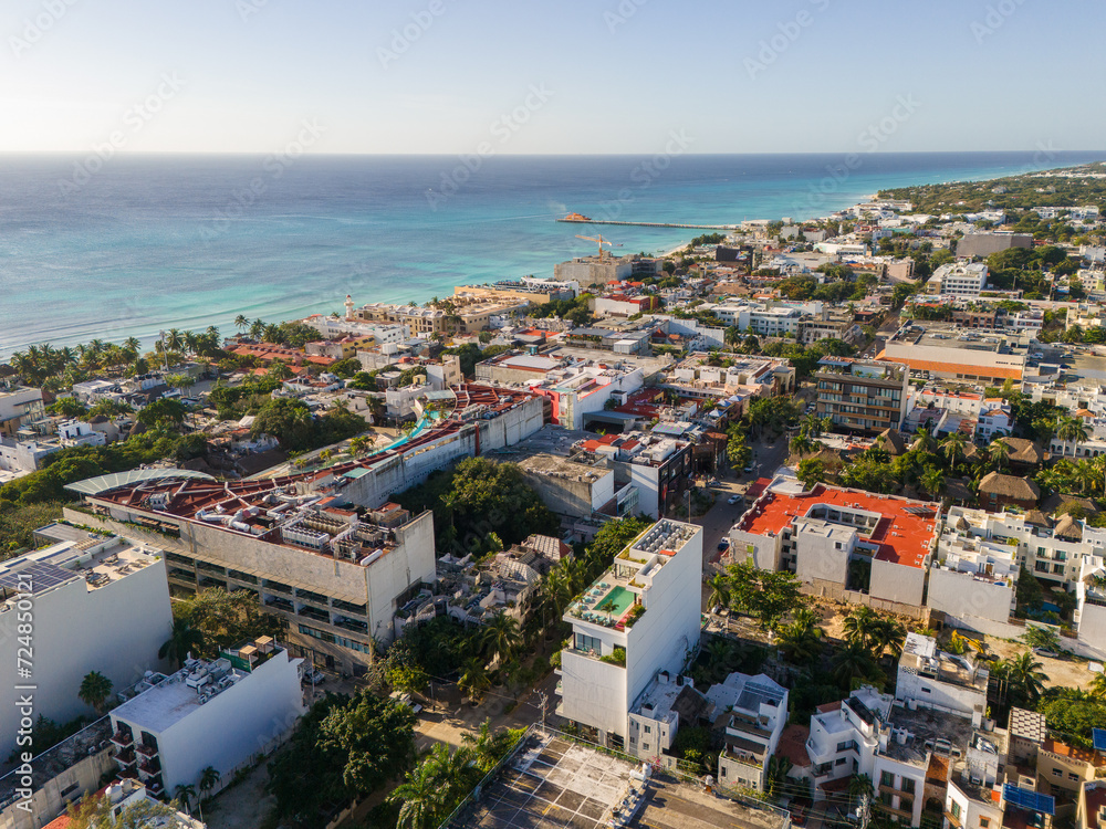 Aerial drone view of blue Caribbean Sea and downtown area in Playa del Carmen on a cloudless blue sky morning 