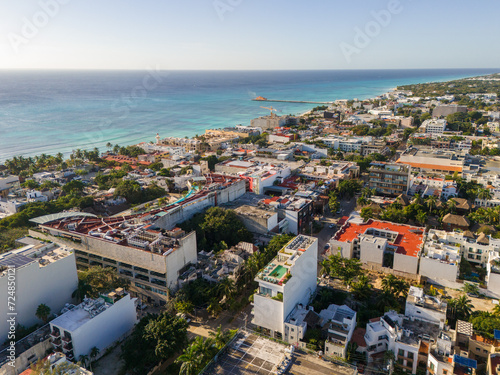 Aerial drone view of blue Caribbean Sea and downtown area in Playa del Carmen on a cloudless blue sky morning 