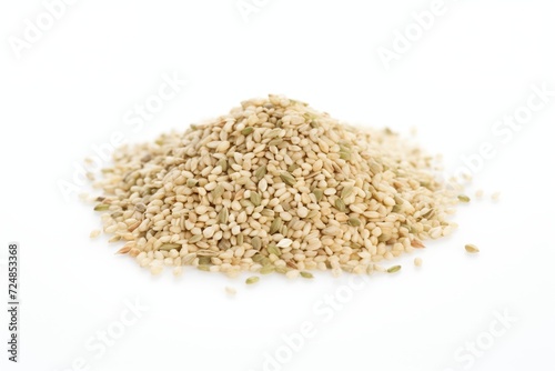 a heap of hulled hemp seeds on a white surface