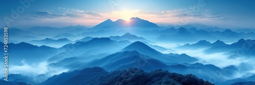 Obraz na płótnie Celestial Dawn: Sunlight Gracing Mist-Clad Mountain Ridges