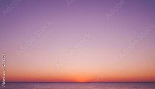 Sunset on the horizon gradient from coral orange to lavender