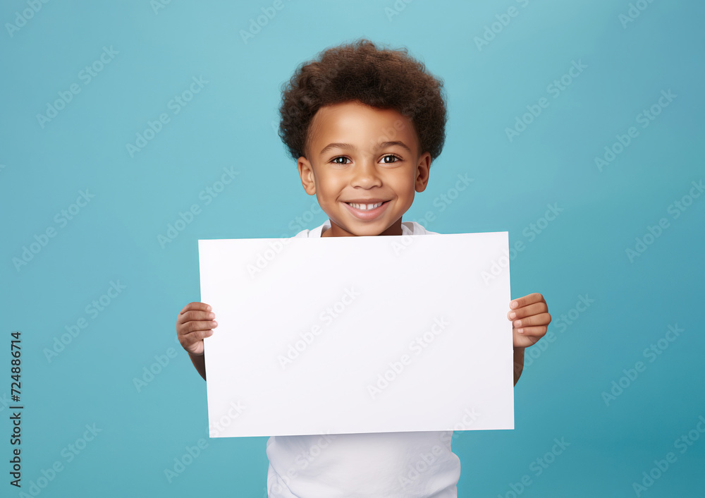 boy hold a blank placard sign poster paper in his hands. empty space for editing on pastel blue background boy hold a blank placard sign poster paper in his hands. empty space for editing on pastel blue background