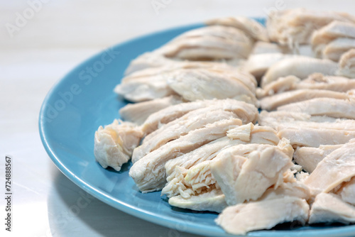  boiled chicken meat on blue plate