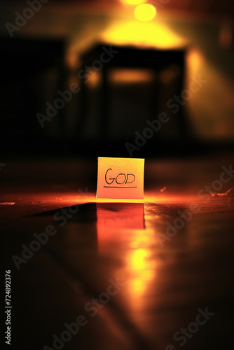 Divine Inspiration - Atmospheric photo of the word GOD written on a post-it note Gen AI photo