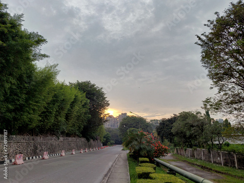 The atmosphere of the street is quiet in the afternoon as the sunset begins to appear