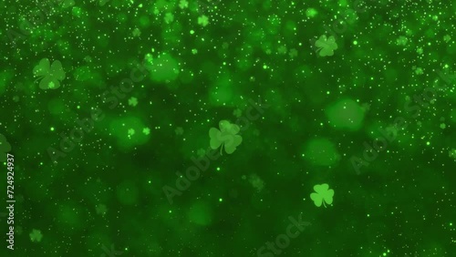 Abstract Motion Green Shiny Blurred Four Leaf Clover St. Patrick's Day With Glitter Sparkles Dust Background Seamless Loop Animation photo
