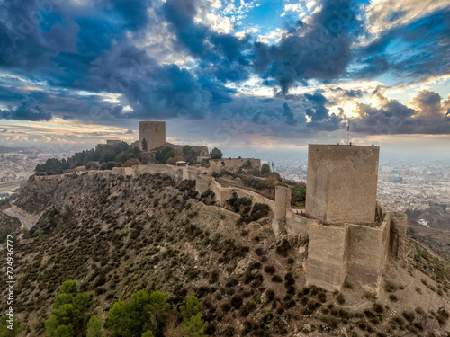 Aerial view of Lorca castle in Southern Spain covering the entire hilltop with large square keep photo
