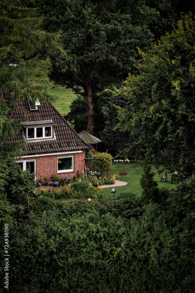 Germany, Europe - 06 19 2022: Little Cosy House Hut In The Woods Forest