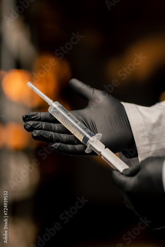 mushroom farm close-up mycologist in gloves holding syringe with mushroom seeds growing natural products