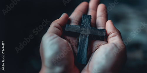 Christian cross clutched in the hand