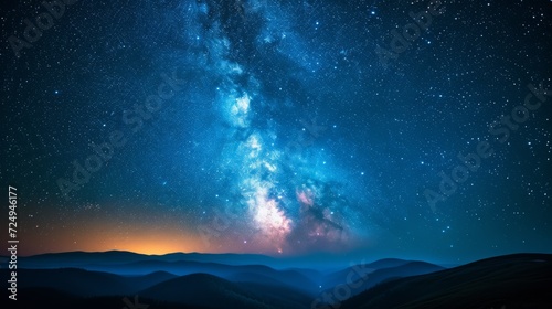 Amazing view of the night sky full of stars and a bright milky way over the mountain range