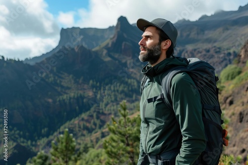 Rugged male model in outdoor apparel Hiking in a breathtaking mountain landscape