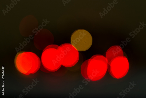 defocused red lights on black background, various circles