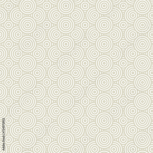 Seamless pattern with overlapping circles in beige color