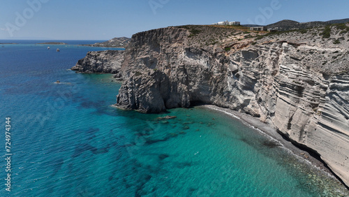 Aerial drone photo of beautiful turquoise beach and cave formations visited by yachts and sailboats in Southern part of Antiparos island, Cyclades, Greece