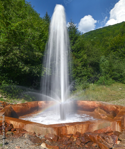 Cold mineral geyser that erupts several times a day with a powerful jet of water in Petrovets tract, village of Vuchkove in Transcarpathia, Ukraine.