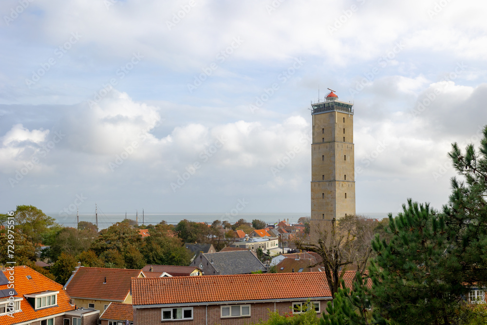 A small town in West-Terschelling with blue sky, Brandaris lighthouse (Vuurtoren Brandaris) on the Dutch Wadden Sea, A municipality and an island in the northern, Terschelling, Friesland, Netherlands.