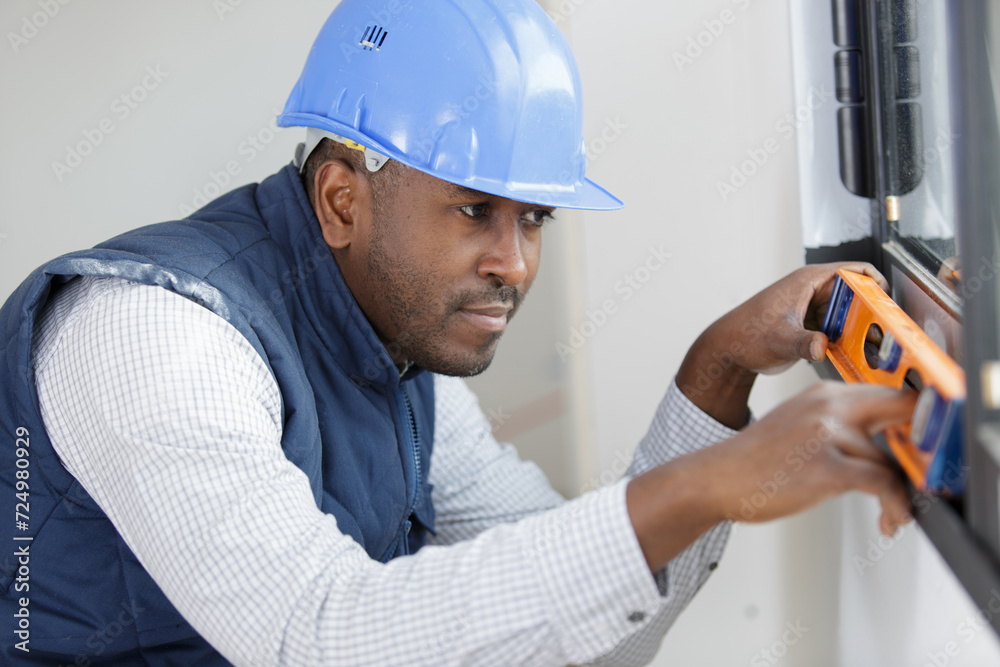 specialist for installing plastic windows checks the level specialist for installing plastic windows checks the level