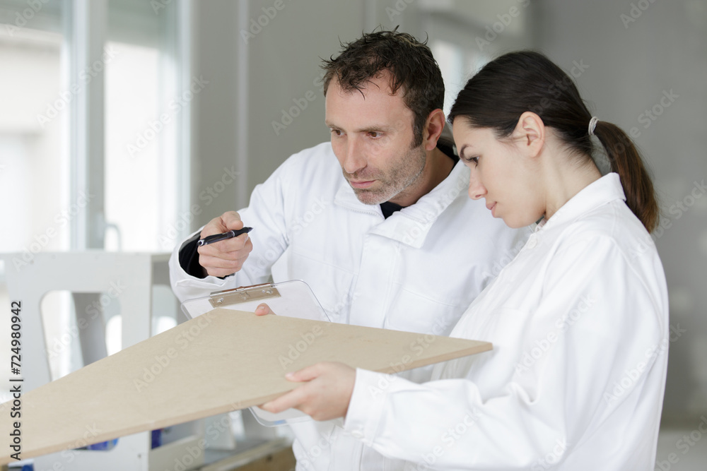 Obraz premium female painter and a male painter in a house