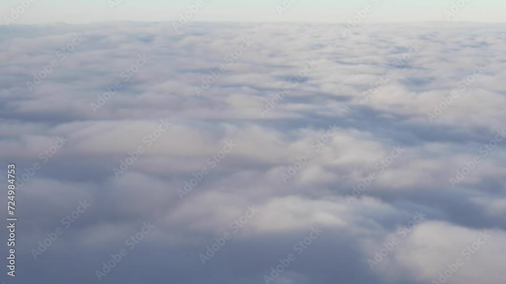 Movement over thick clouds in the morning by plane Movement over thick clouds in the morning by plane