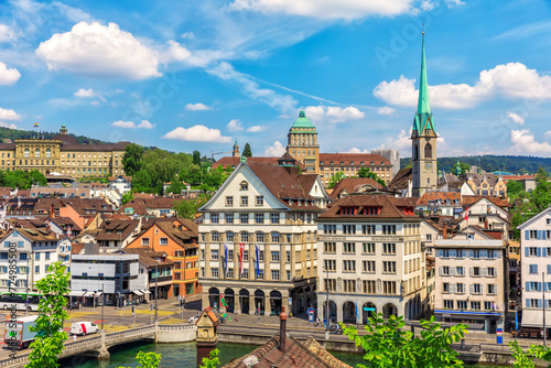 Typical Swiss old architecture with Preacher's Church Tower, Limmat river by the Rudolf Brun Bridge in Zurich, Switzerland photo