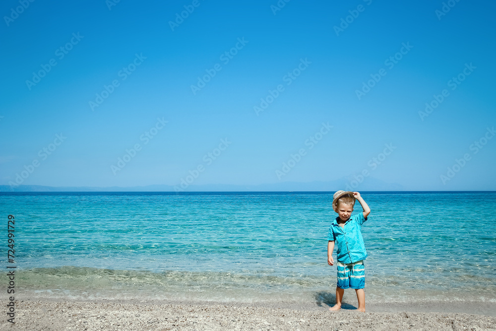 A happy child by the sea in nature weekend travel