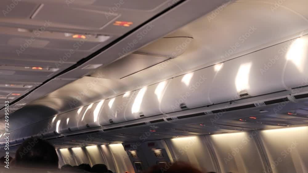 spots of light from illuminator on ceiling and turning off light inside airplane spots of light from illuminator on ceiling and turning off light inside airplane