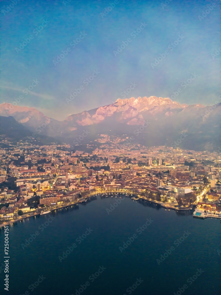 Naklejka premium Aerial shot of the city of Lecco at dusk