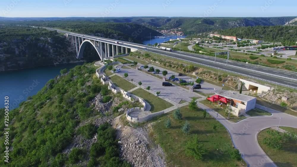 Rest area near Krka river and transport traffic on autostrada bridge at spring Rest area near Krka river and transport traffic on autostrada bridge at spring