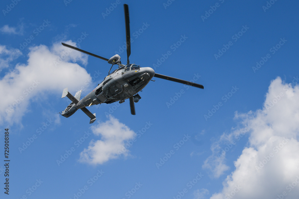 Fototapeta premium Military dauphin helicopter flying in the air.