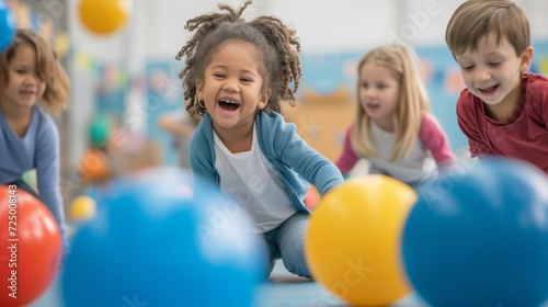Children play with fitness balls in the classroom