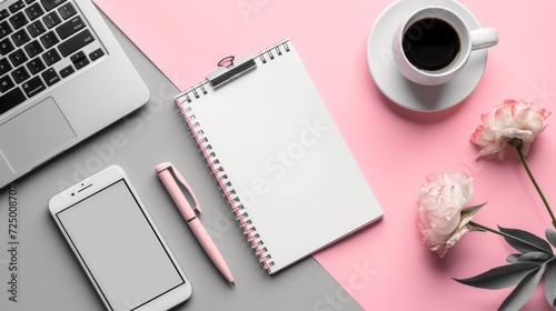 A flat top view of a desktop on which lies a notepad, a pen, a cup of coffee ...