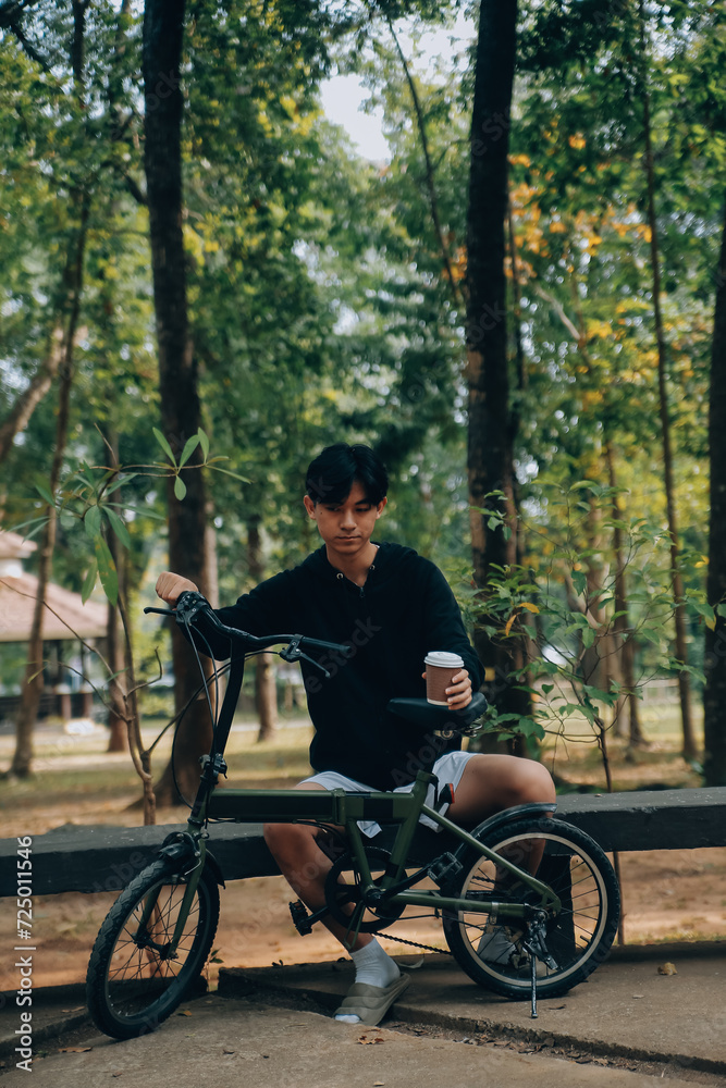 Handsome happy young man with bicycle on a city street, Active lifestyle, people concept Handsome happy young man with bicycle on a city street, Active lifestyle, people concept