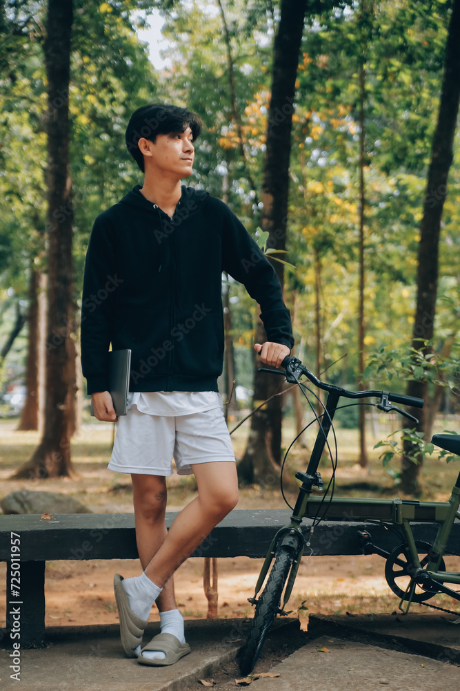Handsome happy young man with bicycle on a city street, Active lifestyle, people concept Handsome happy young man with bicycle on a city street, Active lifestyle, people concept