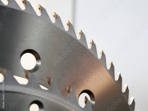 Obraz na płótnie Circular disk saw Wood cutter fragment closeup with hardened cogs. A carpenter tools for a woodworking machine. w salonie