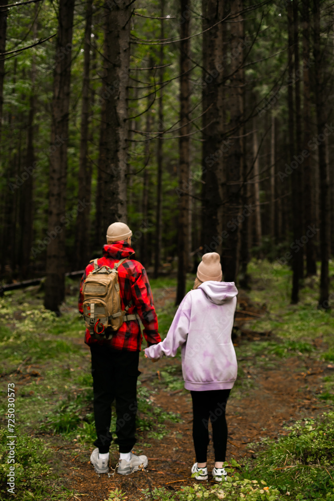 Couple walking in mountain forest Couple walking in mountain forest