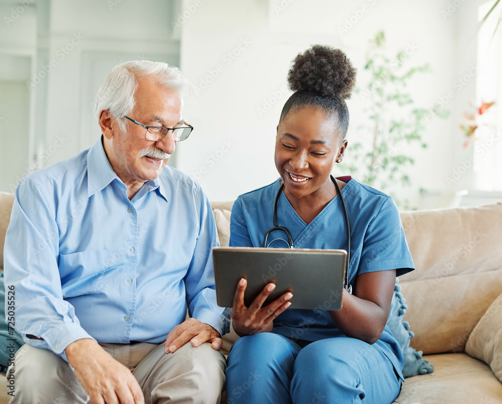 nurse doctor senior care tablet computer technology showing caregiver help assistence retirement home nursing elderly woman african american black happy laughing man nurse doctor senior care tablet computer technology showing caregiver help assistence retirement home nursing elderly woman african american black happy laughing man
