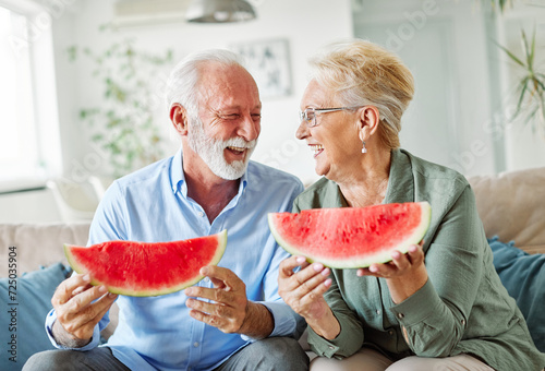 senior woman man couple love elderly watermelon fruit eating food fun togetherness summer cheerful happy smiling together enjoyment healthy eating fresh sharing photo