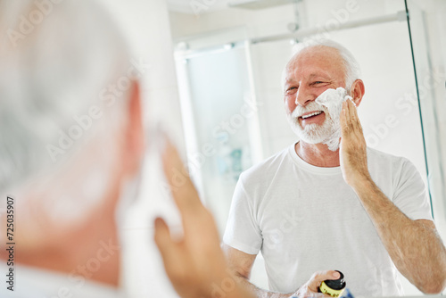 man bathroom shaving senior beard care morning hygiene razor beauty shave skin face hair old mirror skincare elderly routine mature cream grooming foam photo