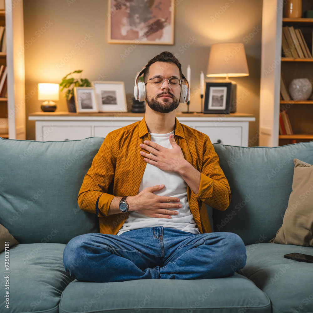 man with headphones practice guided meditation yoga self care at home man with headphones practice guided meditation yoga self care at home