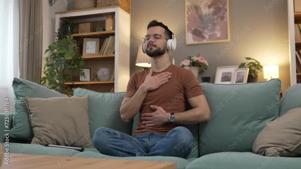 man with headphones practice guided meditation yoga self care at home man with headphones practice guided meditation yoga self care at home