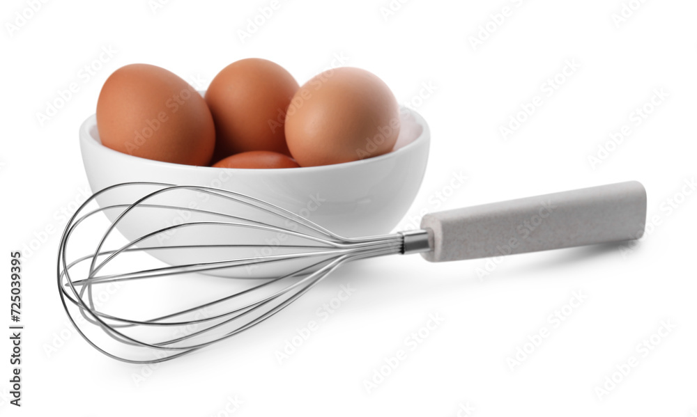 Whisk and bowl with raw eggs isolated on white Whisk and bowl with raw eggs isolated on white
