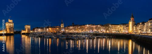 beautiful illuminated cityscape of the old harbor of La Rochelle at night