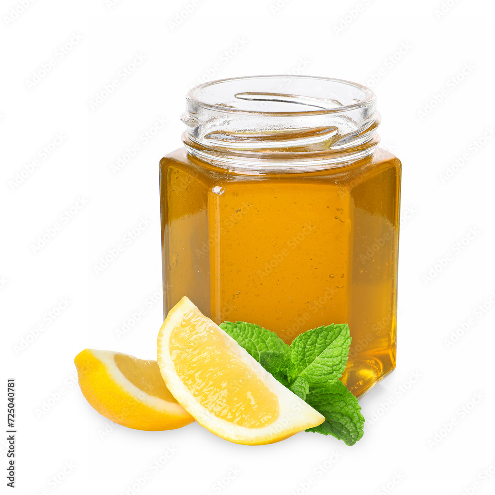 Honey in glass jar isolated on white Honey in glass jar isolated on white
